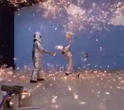 Man Hits Molten Iron with a Shovel