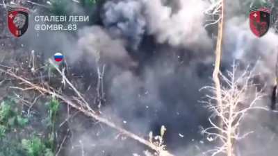 Drone footage of three Russian soldiers, unaware that their anti-drone raincoats are less effective during the day, attempt to infiltrate the positions of the Ukrainian 63rd Mechanized Brigade. Serebryansky forest, Luhansk Oblast.