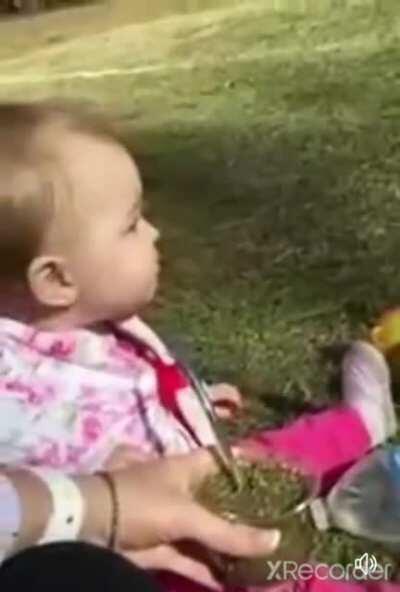 Baby tries herbal tea for the first time