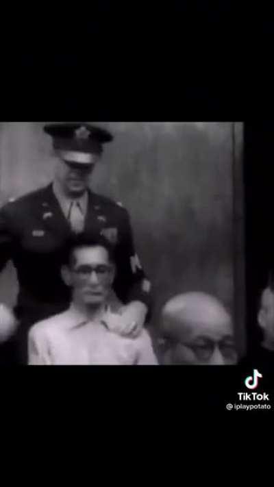 Slapping general Tojo’s head while in court for war crime