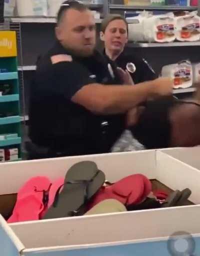 Cop decks lady in Wal-Mart for trying to bite him!
