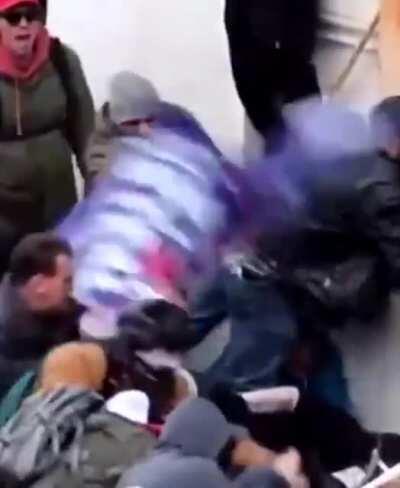 Footage of Trump supporters dragging Officer Sicknick down the stairs and beating him to death.