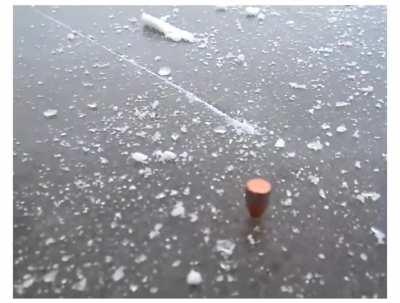 9mm bullet hitting ice