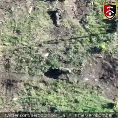 Russian Infantry taking cover behind destroyed Tank being hit by Ukrainian Drone dropped Grenades. Ukraine, 2023.