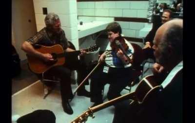 Born blind and deaf in one ear, here is a young Michael Cleveland on the fiddle jamming with Doc Watson