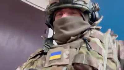 Ukrainians eating rations on the front in Bakhmut. Translation below.