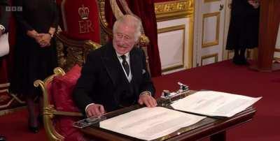 Charles frustrated at the tiny table