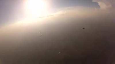 Two skydivers collide mid-air, knocking one of them unconscious. Camera man proceeds to pull some mission impossible shit and saves his life.