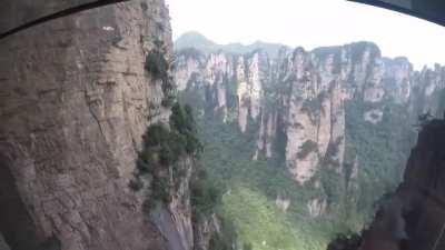 The Bailong Elevator is a glass double-deck elevator built onto the side of a huge cliff in the Wulingyuan area of Zhangjiajie, China