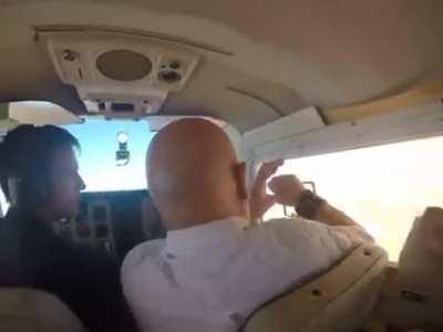 Man wanted a clear shot out of an flying plane and loses his camera