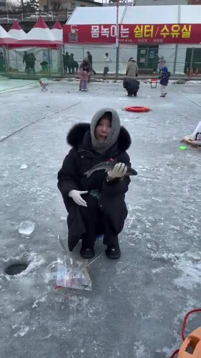 This woman caught a fish.