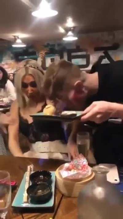 Flaming drink accidentally spilled on the guest