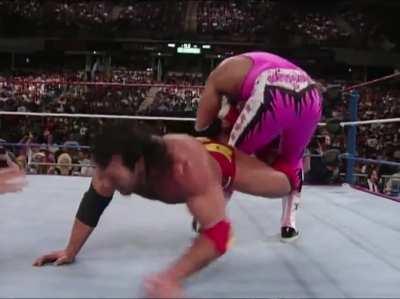 Bret Hart catches Razor Ramon with a Sharpshooter in a creative way.