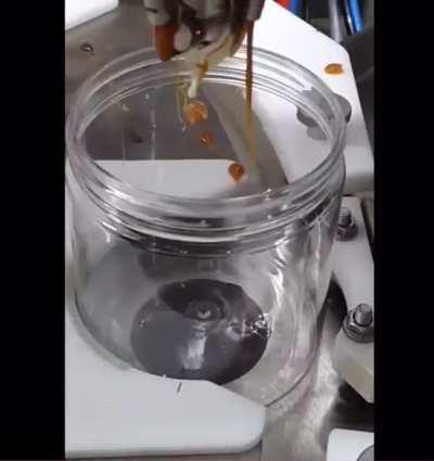 Gelato being filled in a jar