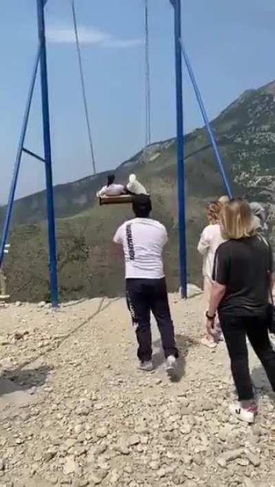 To ride the swing safely