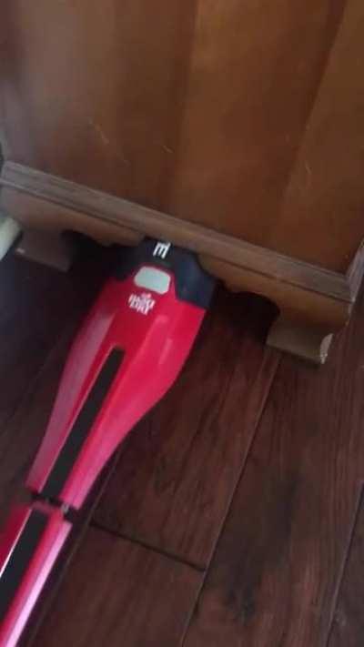 This vacuum cleaner under the cabinet.
