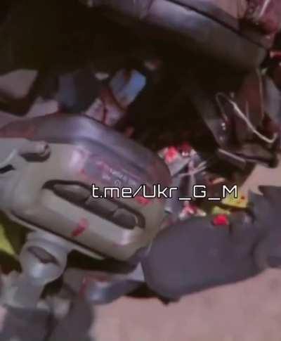 ru pov: Soldier showing a bloodied helmet with a bullet hole.