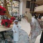 Man pretending to be a life-like doll.