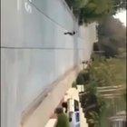 Idiot on skateboard almost getting brain damage