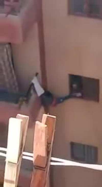 An Egyptian mother almost making her kid fall to his death trying to retrieve the house keys he forgot inside