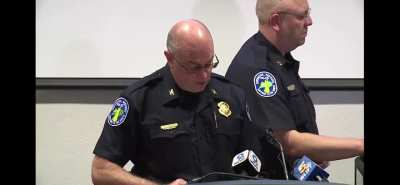 Police Chief Brian Valenti reads a “Use of Force” report and shows body cam footage from the officer who repeatedly punched a man in a red hat during a protest in Cincinnati