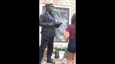 Trying to steal statue's tip money.
