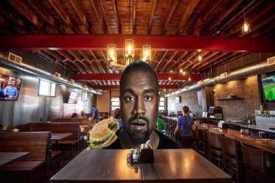Ye enjoys a burger