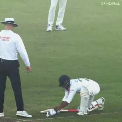 Batter is wasting time. Koach is saying him to remove the shirt also.