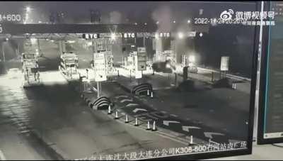 Car goes airborne at tollbooth