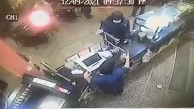 Manager of Asian restaurant shooting a robber to death