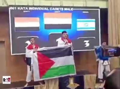 Video of the two players of the U-15 Egyptian youth team for traditional karate raising the flag of Palestine after winning the 1st & 2nd places in the World ITKF Traditional Karate Championship, held in Slovenia.