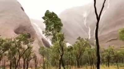 🔥 Uluru (Ayers Rock) during a rainstorm