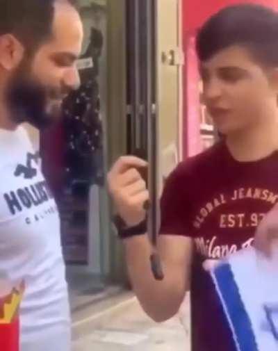 YouTuber gets slapped by Palestinian after asking him to kiss the Israeli flag for 1000$