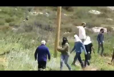 Israeli terrorists attack a 50 year old Palestinian, source in comments.