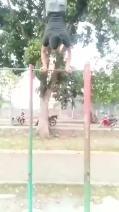 handstand on a pull up bar.