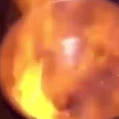 people playing beyblade with a pot