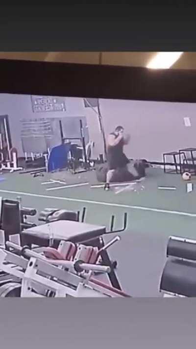 Throwing a dumb-bell across the gym