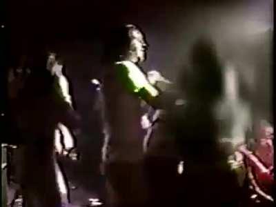 Kurt Cobain getting punched on stage in Dallas, 1991.