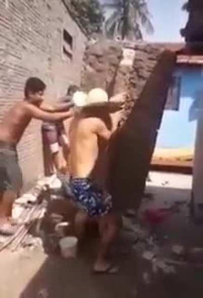 WCGW Demolishing a brick pillar.
