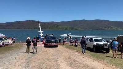 Challenger for the world speed record on water, Spirit of Australia II, passing spectators after a run. Piloted by Dave Warby, whose father Ken has held the world record since 1978 - set on this same dam. Testing new tail fin at the moment so max speed th