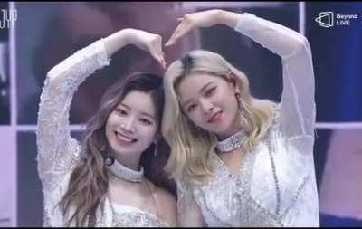 Jeongyeon and Dahyun making a heart