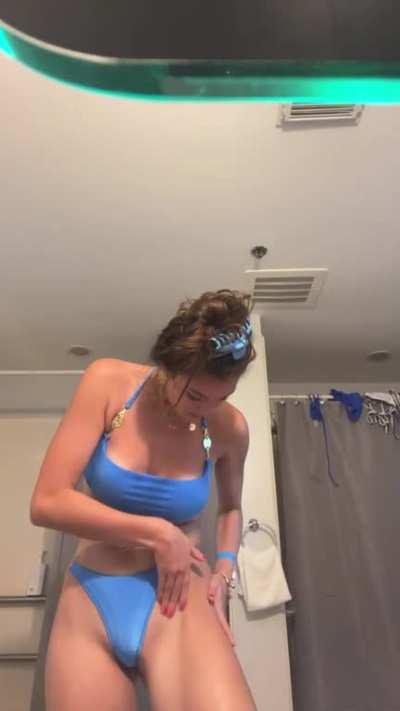 Lotioning her body in a bikini Part 1