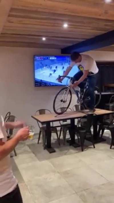 Riding off a table with a bike