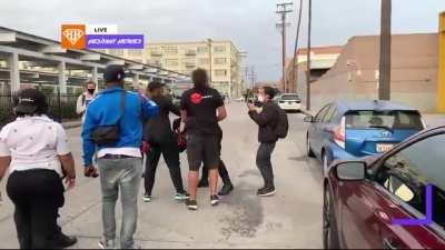 Man is pushed back by a mob of BLM supporters in downtown LA, 10/24