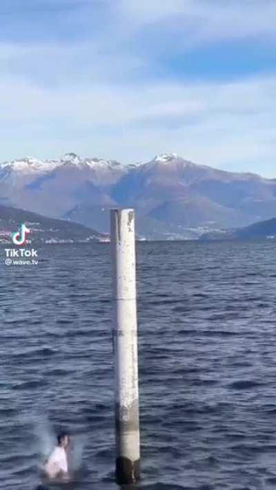To backflip off of a post in the ocean