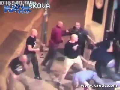 Group of skinheads knock some folks out outside a bar.