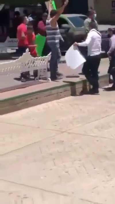 The narco-governor Silvano Aureoles escorted by criminals from the government caught on camera pushing a protester in agulilla. Not really big news just wanna show how much of a coward he is.