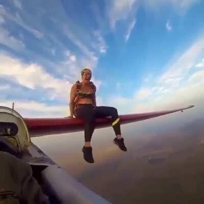 Jumping off a plane after sitting on it wings