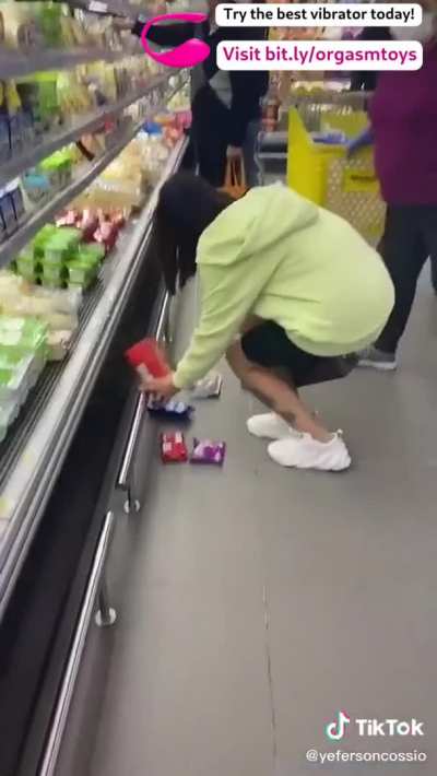 Controlling her vibrator at the shop