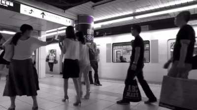 Kesha singing loudly on the subway in Japan